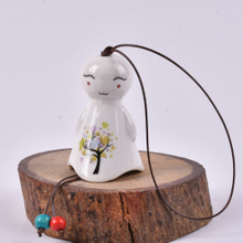 Porcelana encantadora pequeña linda risa flores soleadas muñecas, campanas de viento