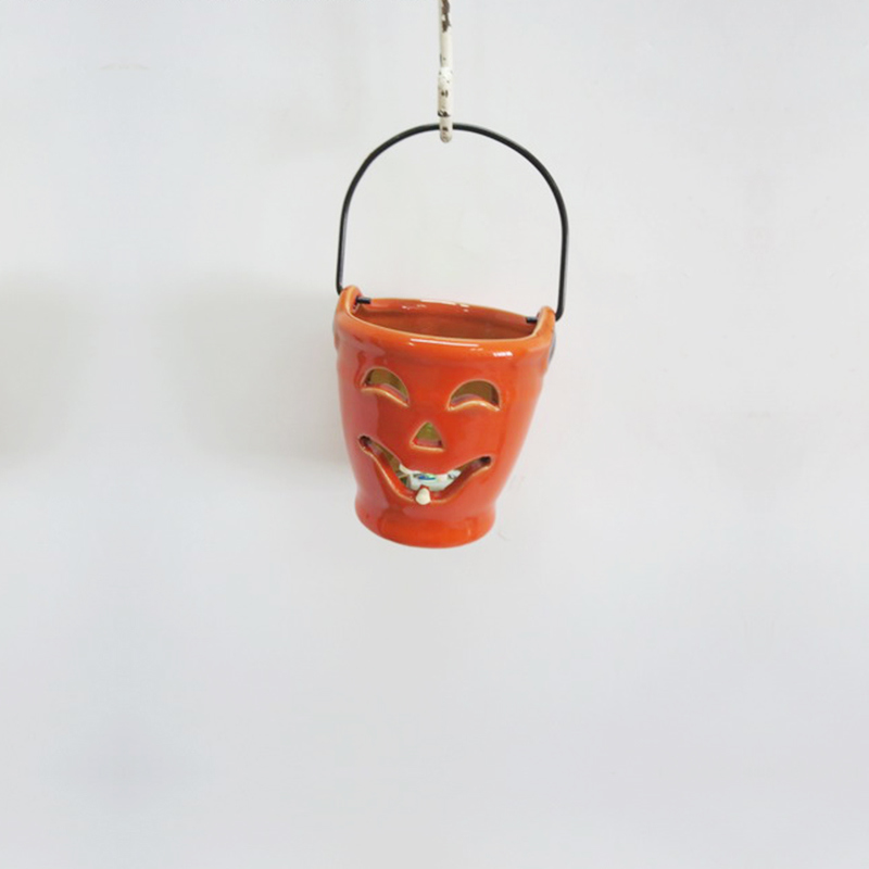 Portavelas de cer&aacute;mica port&aacute;til de calabaza