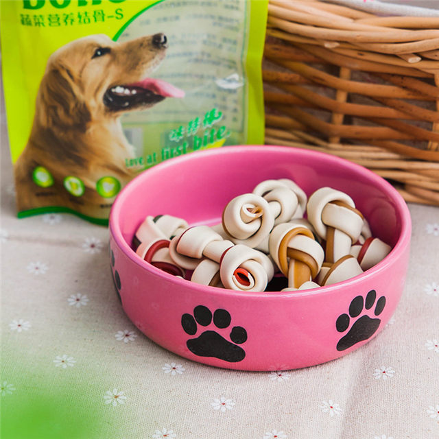 con huellas de perro Impresión de hueso circular impreso en el tazón Fondo de alimentación de cerámica para perros Alimentador de cerámica para mascotas de color rosa Tazón de cerámica para perros de color rosa