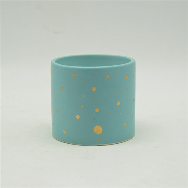 Velas de cerámica moteadas de azul y oro