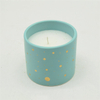 Velas de cerámica moteadas de azul y oro