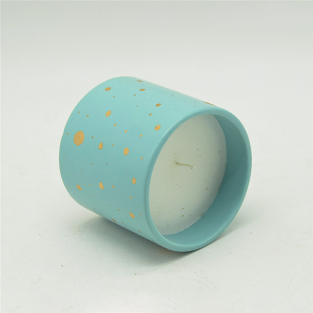 Velas de cerámica moteadas de azul y oro